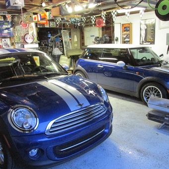 Mini Coopers in Decorated Garage with Signs - Super Coopers from Evansville, Indiana