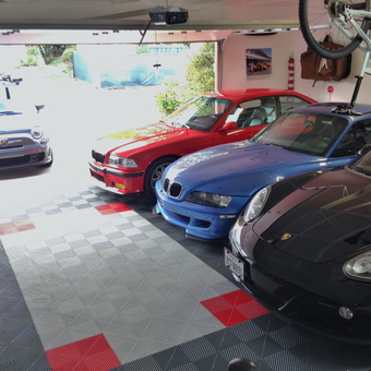 Garage with RaceDeck Flooring and Sports Cars - Colin Camisasca from Newport Beach, CA