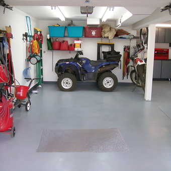 Organized garage with ATV, cabinets, and wall storage - Peter from Lakewood, CO