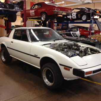Classic Cars on Lifts and Tools in Garage - Gunn High School Autoshop