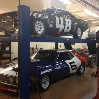 Classic Race Cars on Two Post Lift in Garage - Gunn High School Autoshop