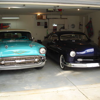 Classic Cars in Organized Garage with Wall Decor - Merc Man from Douglas, Mi
