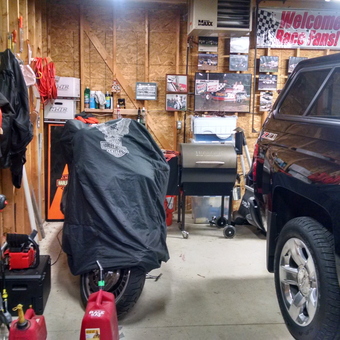 Organized garage with tools, Harley cover, truck - Rick from Mukwonago, WI