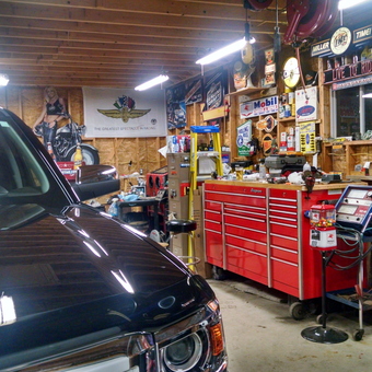 Organized garage with tool chest, signs, and motorcycle - Rick from Mukwonago, WI