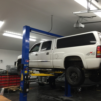 Truck on Two Post Lift in Organized Garage - Patch from Prince George, British Columbia Canada