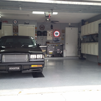 Classic car, metal cabinets, and wall signs in garage - Lewen from Kissimmee, FL