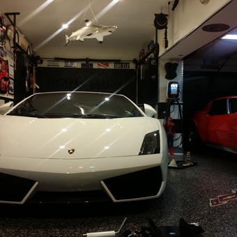 Luxury Cars and Wall Decor in Custom Garage - Snowmanmart from Baldwin, New York