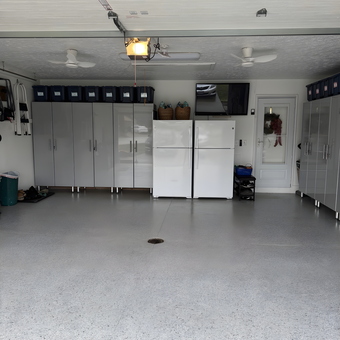 Modern garage with gray cabinets and storage bins - Lorraine