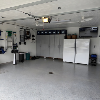Organized Garage With Storage Cabinets and Epoxy Floor - Lorraine