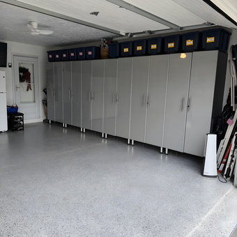 Modern Garage with Gray Storage Cabinets and Epoxy Floor - Lorraine