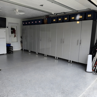 Modern Garage with Gray Cabinets and Storage Bins - Lorraine