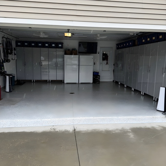 Modern garage with sleek cabinets and storage bins - Lorraine