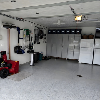 Organized Garage with Cabinets, Wall Racks, and Epoxy Floor - Lorraine