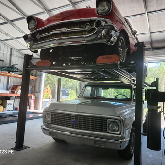Classic car lift with vintage vehicles in organized garage - Wayne from Georgetown, FL