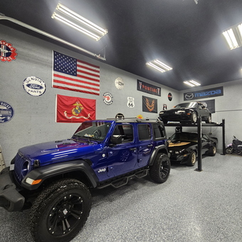 Custom garage with car lift, wall signs, and epoxy floor - Jason from Cincinnati, OH