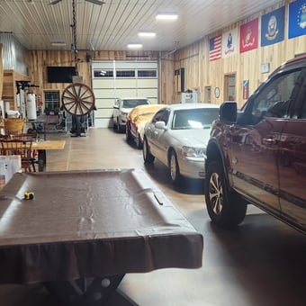 Spacious garage with vehicles, pool table, and wall decor - Jeremy from CLARKSVILLE