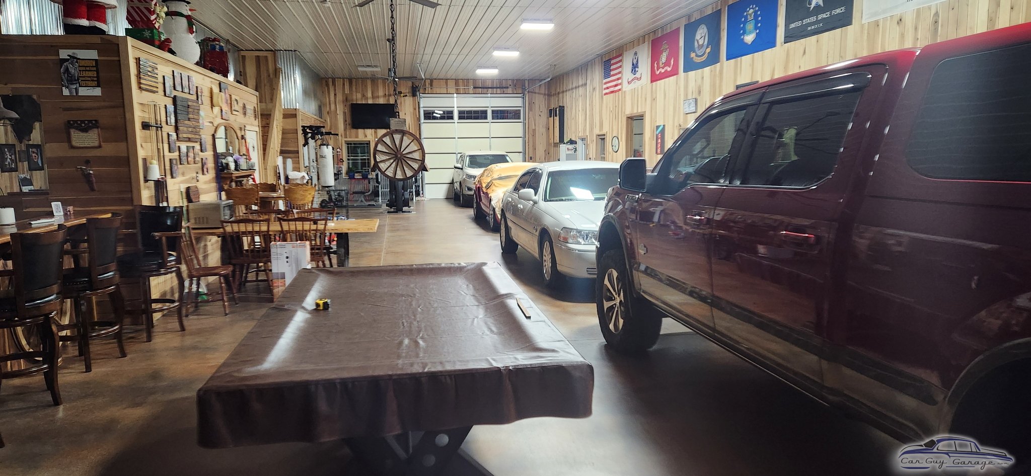 Spacious garage with vehicles, pool table, and wall decor - Jeremy from CLARKSVILLE