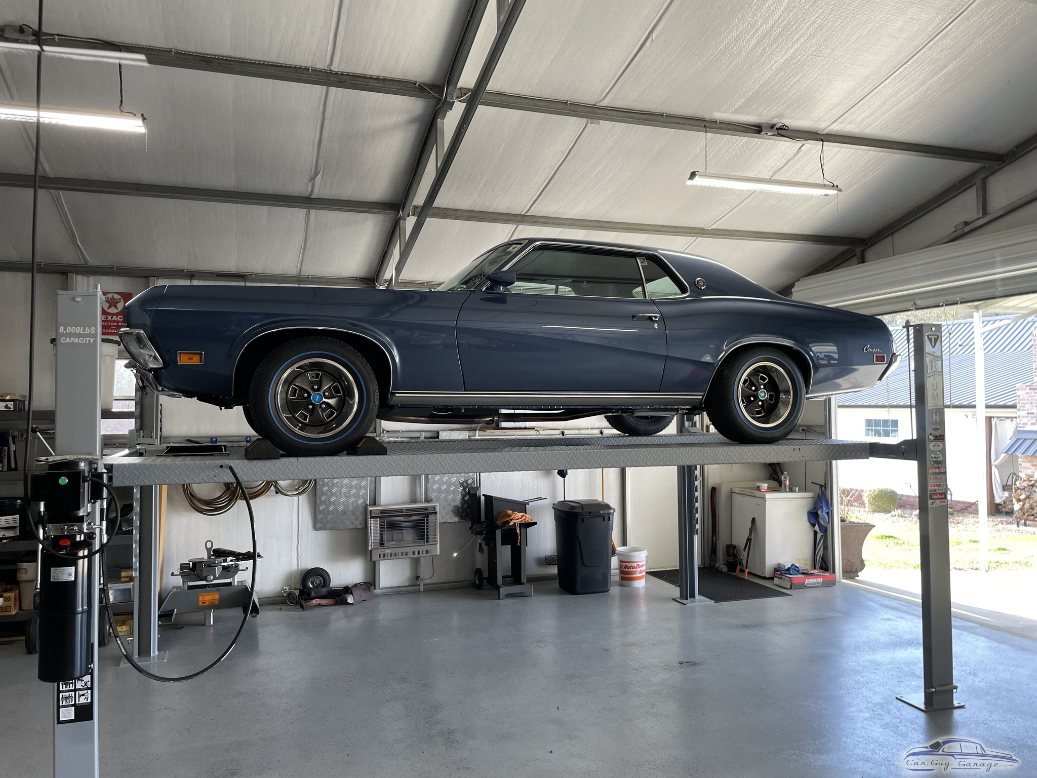 Classic car on four post lift in clean garage - Mike from Philadelphia, MS