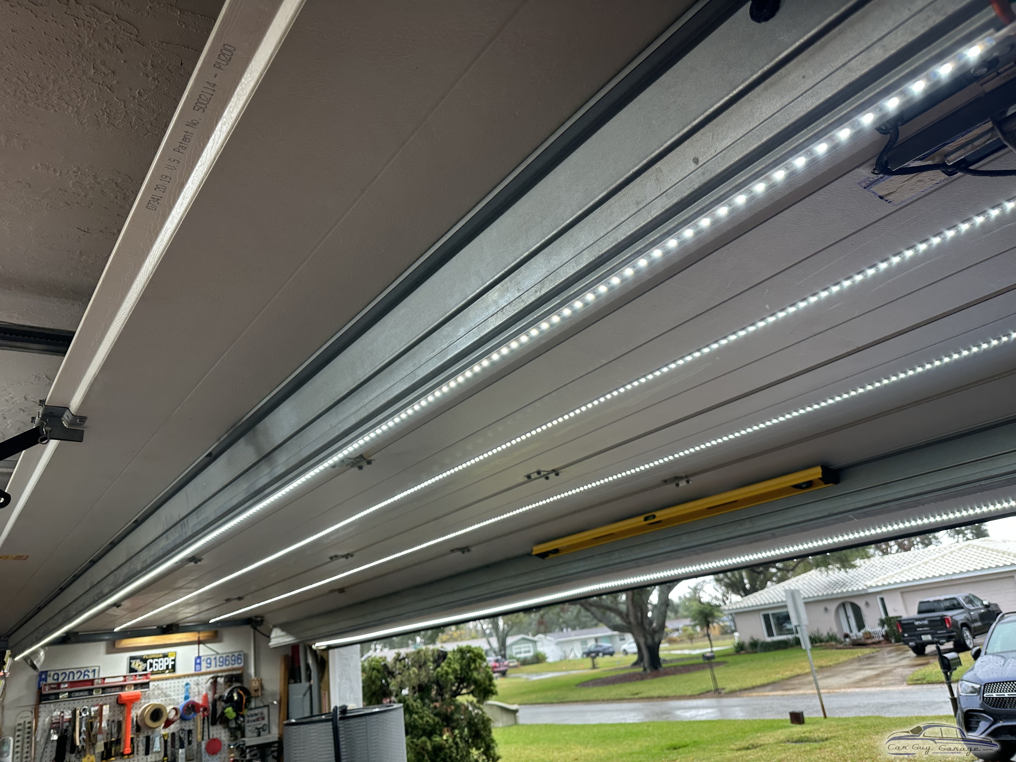 Bright LED Strip Lighting and Organized Garage Workshop Wall
