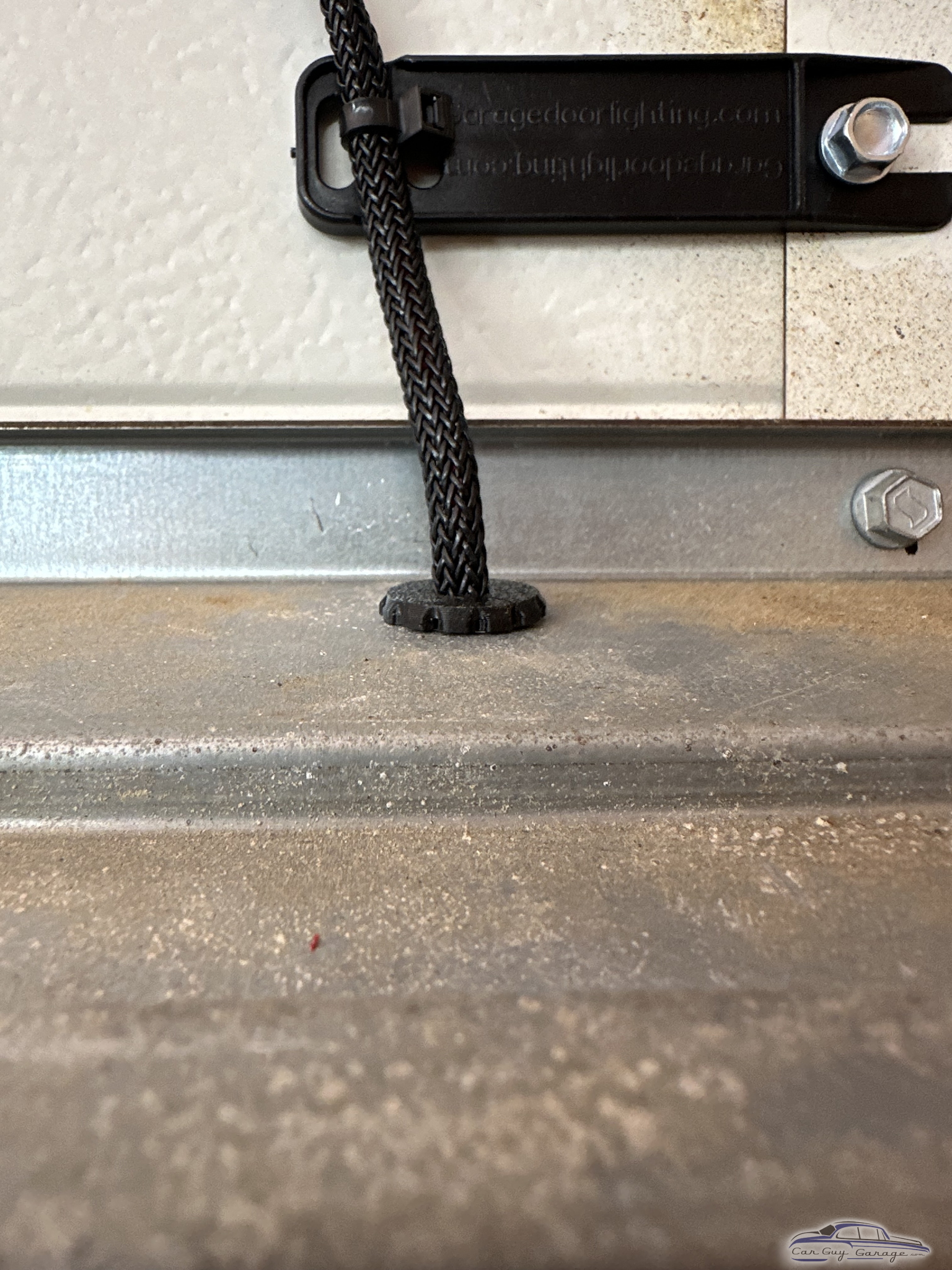 Garage Door Emergency Release Rope and Mount Hardware Close-Up