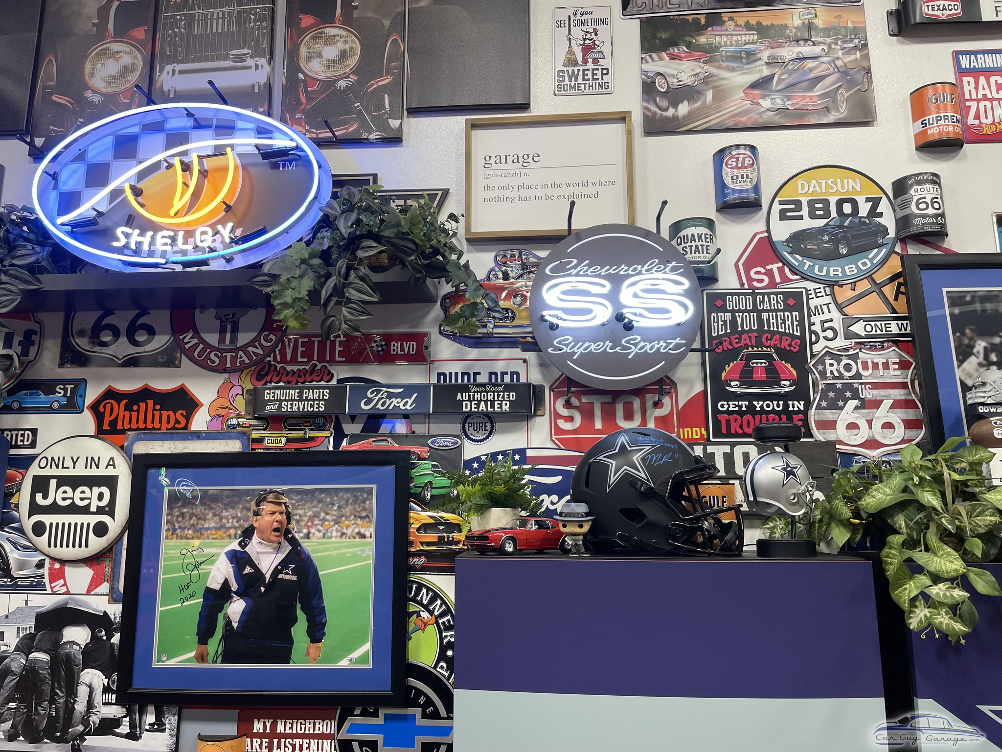 Garage Wall with Neon Signs, Vintage Car Decor, and Helmets