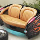 1957 Blazing Black Flames Corvette with Tan Leather Couch