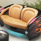 1957 Blazing Black Flames Corvette with Tan Leather Couch