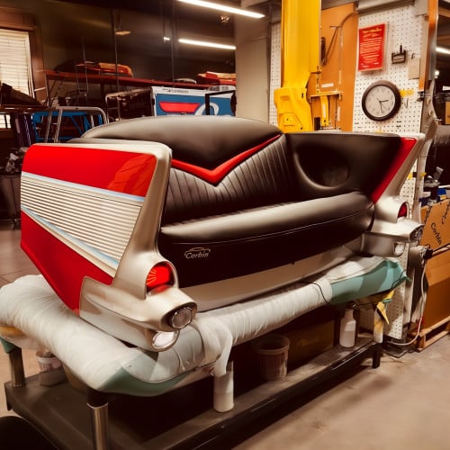 Red 1957 Chevy with Black Couch