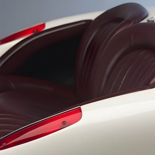 1957 Vibrant White Corvette with Bright Red Leather Couch
