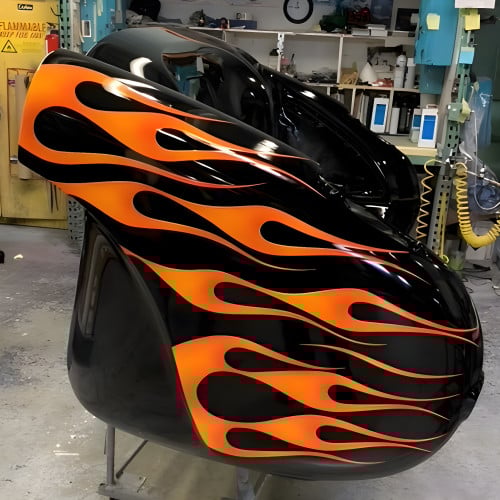 1957 Blazing Black Flames Corvette with Tan Leather Couch