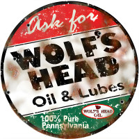 Wolf's Head Oil And Lube Metal Sign - 24" Round