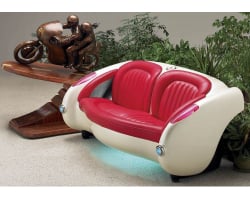 1957 Vibrant White Corvette with Bright Red Leather Couch