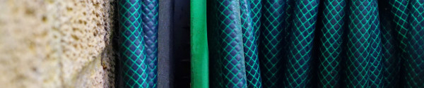 Wall-mount garden hose holders