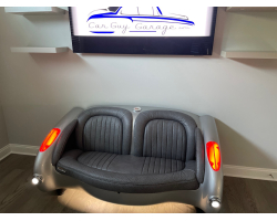 1957 Gunmetal Gray Corvette with Black Leather Couch