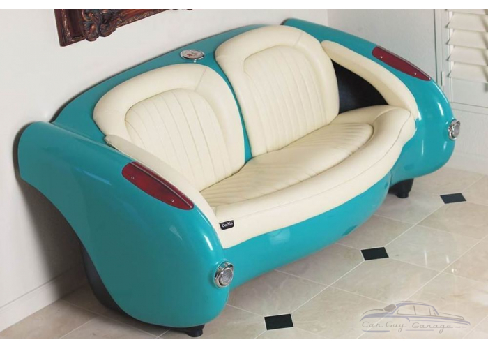 1957 Vibrant White Corvette with Bright Red Leather Couch